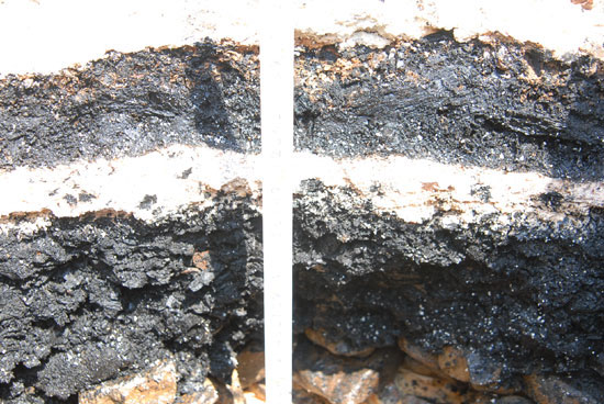 Layer of charcoal in the foundation part of central structure of the site of Koguryo Chomsongdae Observatory Layer of charcoal in the foundation part of central structure of the site of Koguryo Chomsongdae Observatory