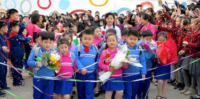 Pupils dressed in new uniforms on the starting day of school