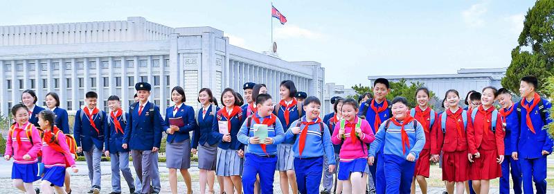 Students and children in new school uniforms